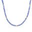 Product picture of a tanzanite beaded necklace with five gold spacing beads, finished with a round gold clasp.