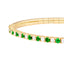 A diamond and emerald alternate stone design bangle. This bangle has gold flex technology and can easily be put onto the wrist. Finished with a secure clasp. 