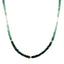 A emerald necklace with an ombre look, created with different shaded green and gold bead spacing. 