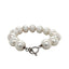 Product picture featuring a large fresh water pearl bracelet with silver taggle clasp. This bracelet is hand knotted with white silk in between each pearl. Showing the silver toggle side.