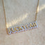 Product picture of a bubble font gold name necklace with a diamond pave frame. This necklace is a statement necklace that reads "Fuckyeah". 