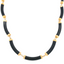 Pictured is a vintage black onyx tube necklace made with black onyx curved tube joints connected with solid 14k gold. 