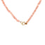 Product picture of a pink opal beaded necklace showing the round clasp part. 