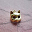 A product picture of a solid gold cat mast pendant. This charm is a mask of a cat made in 3d with round cute cat face and pointy ears. 