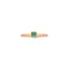 Product picture of a dainty gold band with a princess cut emerald bezel set with two small stones on on side of the band. 